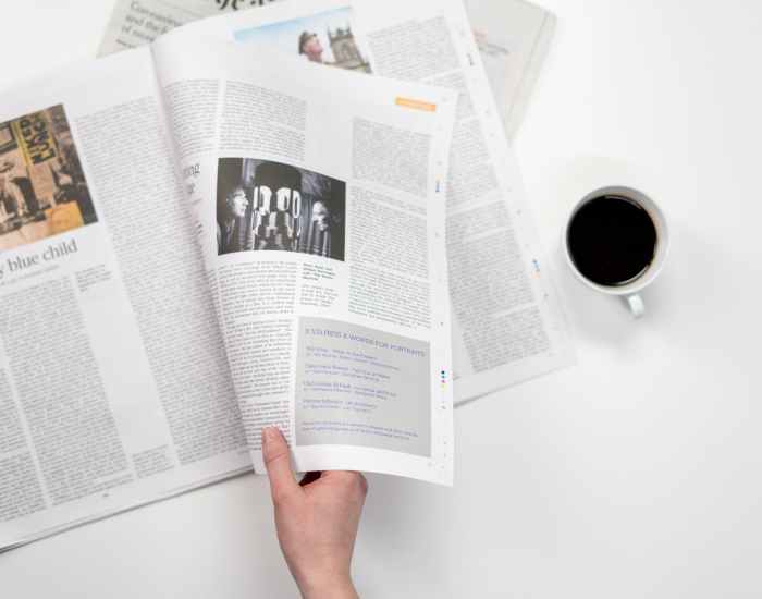 person holding white printer paper